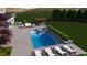 Backyard pool and spa featuring an outdoor kitchen, pergola, and lush landscaping at 213 Westhampton Dr, Pittsboro, NC 27312