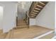 Modern staircase with wood steps, black metal railings, and decorative wall panels at 213 Westhampton Dr, Pittsboro, NC 27312