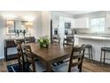 Dining area with dark wood table and chairs, adjacent to the kitchen at 137 Tormore Dr, Sanford, NC 27330