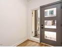 Modern foyer with natural light, a stylish door, and pristine white walls, creating an inviting space at 1523 Havenmont Ct, Raleigh, NC 27608