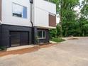 Townhome featuring a modern garage with dark brick and black garage door at 1527 Havenmont Ct, Raleigh, NC 27608