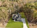 Aerial view showcasing the beautiful two-story home, surrounded by lush trees and a well-manicured lawn at 143 Hook Dr # 23, Fuquay Varina, NC 27526