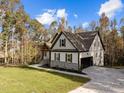 Two-story house with stone accents and a large backyard at 143 Hook Dr # 23, Fuquay Varina, NC 27526