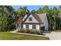 This home has beautiful yard, an attached garage, and stone accents at 143 Hook Dr # 23, Fuquay Varina, NC 27526