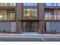 Apartment building entrance with secure doors, modern planters, and prominent address numbers at 600 N Roxboro St # 24, Durham, NC 27701
