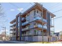 Contemporary condo building with multiple balconies offering city views and modern architectural details at 600 N Roxboro St # 43, Durham, NC 27701