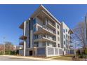 Stylish, multi-story condo building featuring sleek lines, private balconies, and contemporary design at 600 N Roxboro St # 43, Durham, NC 27701