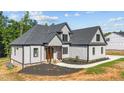 New construction showing a beautiful two-story home with gray shingles and white siding at 4268 Jacks Creek Trl, Burlington, NC 27215