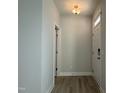 Bright entryway with wood flooring and a white front door leads to other rooms at 492 Traditions Grande Blvd # 26, Wake Forest, NC 27587