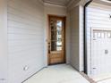 Stylish wood front door providing a warm welcome to this charming home at 804 Ambercrest Place, Durham, NC 27705