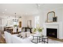 Open-concept living area with fireplace and dining space, perfect for entertaining and everyday living at 30 Imperial Oaks Ct, Youngsville, NC 27596