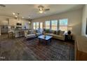 Open living room and kitchen with hardwood floors and lots of natural light at 141 Beacon Hill Rd # 13, Lillington, NC 27546