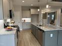Spacious kitchen boasts stainless steel appliances, granite countertops, and a large island with a sink at 27 Prency Ln, Middlesex, NC 27557