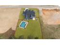 Aerial view of a home featuring a backyard swimming pool in a spacious, fenced-in yard at 262 Hook Dr # 12, Fuquay Varina, NC 27526