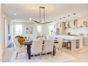 Bright, open-concept dining area connected to the kitchen and living room with modern decor at 600 N Roxboro St # 22, Durham, NC 27701