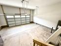 Spacious two-car garage with clean concrete floor and neutral-colored walls at 152 Southern Estates Dr, Sanford, NC 27330