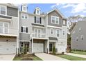 Beautiful townhomes with craftsman-style architectural elements and individual garage and balcony at 125 Sugar Run Dr # 26, Fuquay Varina, NC 27526