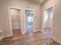 Spacious hallway with multiple doors leading to bedrooms and closets at 127 Sugar Run Dr # 27, Fuquay Varina, NC 27526