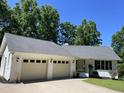 Charming, white brick single-story home with a two-car garage at 3309 Westcott Cir, Sanford, NC 27330