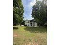 Spacious backyard featuring a two-story deck and large lawn, perfect for outdoor living at 3309 Westcott Cir, Sanford, NC 27330