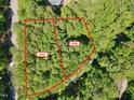 Aerial shot showcases the lot with mature trees, offering privacy and natural beauty to build your home at 2332 Windy Woods Dr, Raleigh, NC 27607