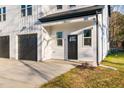 Modern home exterior with black garage doors and a front entry at 329 Roxboro St, Haw River, NC 27258