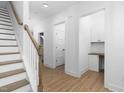 Clean hallway with light wood floors and built-in shelving at 329 Roxboro St, Haw River, NC 27258