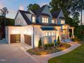 Beautiful two-story home with a brick and stone facade, a two-car garage, and manicured landscaping at 1621 Legacy Ridge Ln, Wake Forest, NC 27587