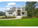 Charming two-story home with brick and stone details, fresh landscaping, and a welcoming front porch at 1621 Legacy Ridge Ln, Wake Forest, NC 27587