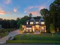 Expansive two-story home with well-manicured lawn, long driveway, and beautiful trees in a private and peaceful setting at 1621 Legacy Ridge Ln, Wake Forest, NC 27587