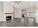 Open living room featuring hardwood floors and fireplace at 125 Prosecco Dr, Princeton, NC 27569