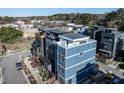 Newly built three-story residence showcases a rooftop terrace and contemporary architecture in a developing neighborhood at 618 Velma Hopkins Ln, Raleigh, NC 27603