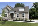 Charming single-Gathering home with stone accents and well-maintained landscaping at 69 Browning Mill Dr, Wendell, NC 27591