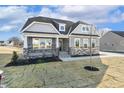 Charming single Gathering home featuring a welcoming front porch and stone accents on the facade at 55 Browning Mill Dr, Wendell, NC 27591