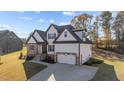 Beautiful new home featuring white siding and a spacious driveway leading to the garage at 148 Hook Dr # 7, Fuquay Varina, NC 27526