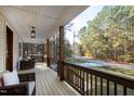 Spacious front porch offering outdoor seating and scenic neighborhood views at 158 Nakoma Dr, Louisburg, NC 27549