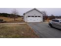 Detached garage with double door and additional parking at 1850 Gillburg Road, Henderson, NC 27537