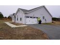Attached garage with a double door and ample parking space at 1850 Gillburg Road, Henderson, NC 27537