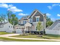 Beautiful two-story home with a well-kept lawn and an attached two-car garage in a friendly neighborhood at 9113 Dupree Meadow Dr # 41, Angier, NC 27501