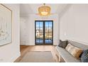 Bright and airy foyer with hardwood floors and a bench at 9009 Meadow Pointe Ct, Wake Forest, NC 27587