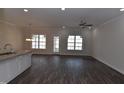 Spacious living area with hardwood floors and access to patio at 190 Brunswick Dr, Nashville, NC 27856