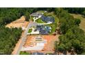 Aerial view of multiple homes under construction in an upscale residential neighborhood at 4813 Parker Meadow Dr, Raleigh, NC 27614