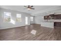 Open living space featuring hardwood floors and an island kitchen at 176 Van Winkle St, Lillington, NC 27546