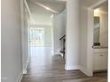 Welcoming foyer features sleek flooring, neutral walls, and an open view of the spacious living area at 592 Barbour Farm Ln, Four Oaks, NC 27524