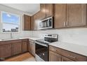 Close up of the kitchen, with stainless steel appliances and shaker cabinets at 270 Chestnut Oak Ln, Lillington, NC 27546