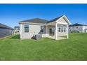 Back of house featuring covered patio and grassy yard at 234 Chestnut Oak Ln, Lillington, NC 27546