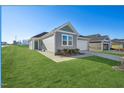 Modern single-story home with a green lawn at 234 Chestnut Oak Ln, Lillington, NC 27546