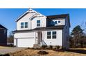 Two-story house with gray siding, white trim, and a two-car garage at 395 Fast Pitch Ln, Four Oaks, NC 27524