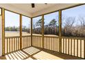 Spacious screened porch overlooking the backyard at 411 Fast Pitch Ln, Four Oaks, NC 27524