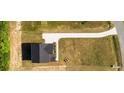 Aerial view of a home, showing a large lot and a long driveway at 427 Fast Pitch Ln, Four Oaks, NC 27524